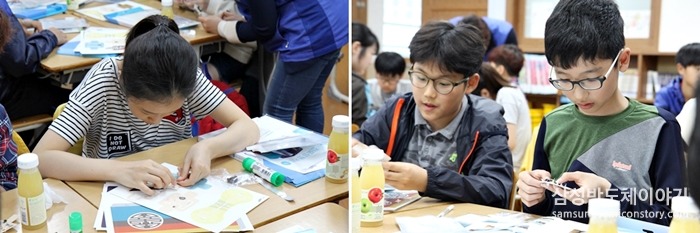 회로 기판 키트를 꼼꼼히 살펴보는 학생들